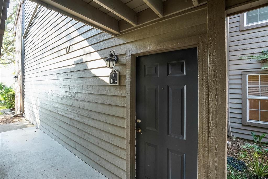2500 Winding Creek Boulevard, Unit A104 Clearwater, FL 33761 - Photo 4 of 31 a view of wooden door