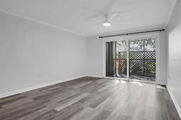 a view of an empty room and wooden floor