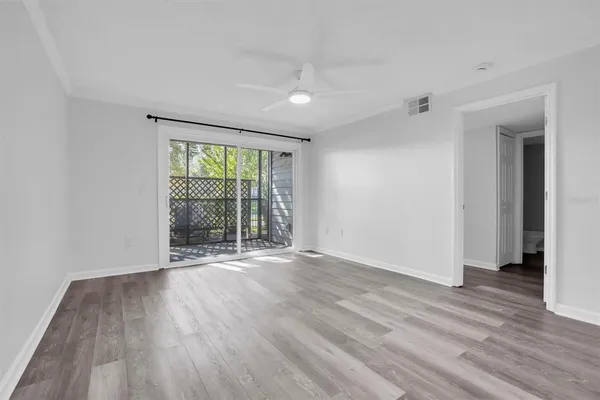 a view of a kitchen cabinets a wooden floor and a kitchen space