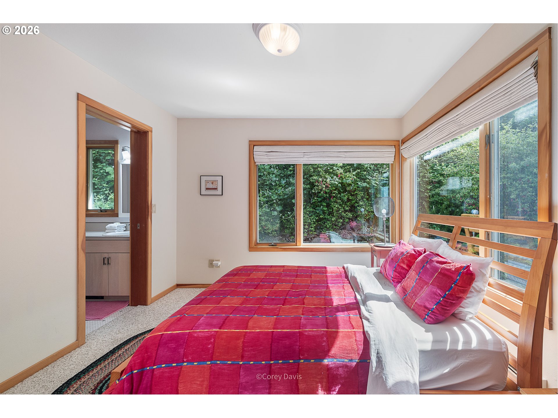38295 Beulah Reed Road Nehalem, OR 97131 - Photo 36 of 42 a bedroom with a bed and a large window