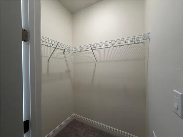 a view of a room with racks on the wall