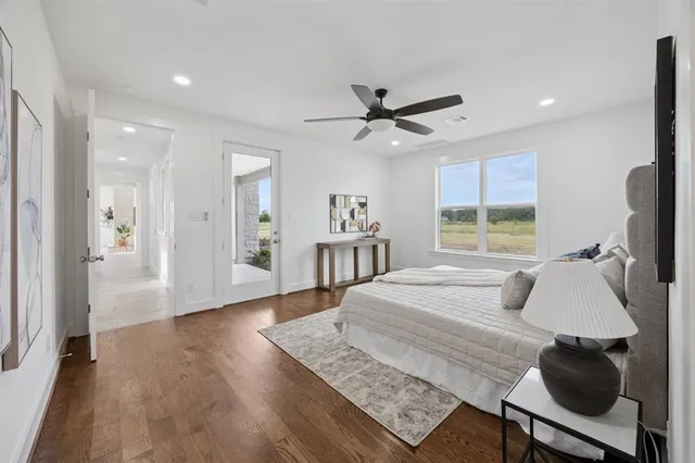 a bed room with a bed window and a chair