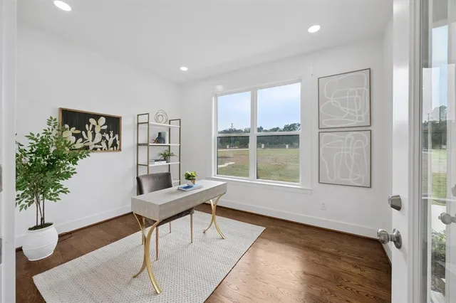 a workspace with furniture and a potted plant