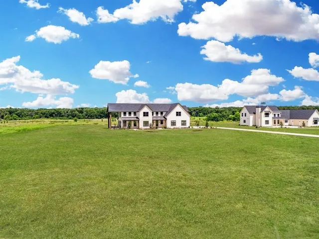 a view of a house with a big yard