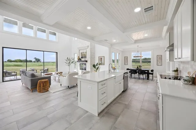 a large white kitchen with lots of counter top space