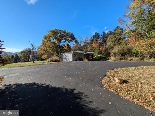 a view of a road with a building in the background