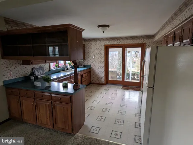 a kitchen with stainless steel appliances a stove and a refrigerator