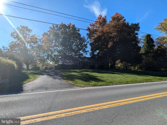 a view of a yard and a street view