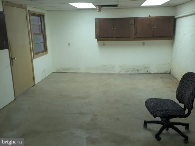 a view of a chair and table in a bathroom