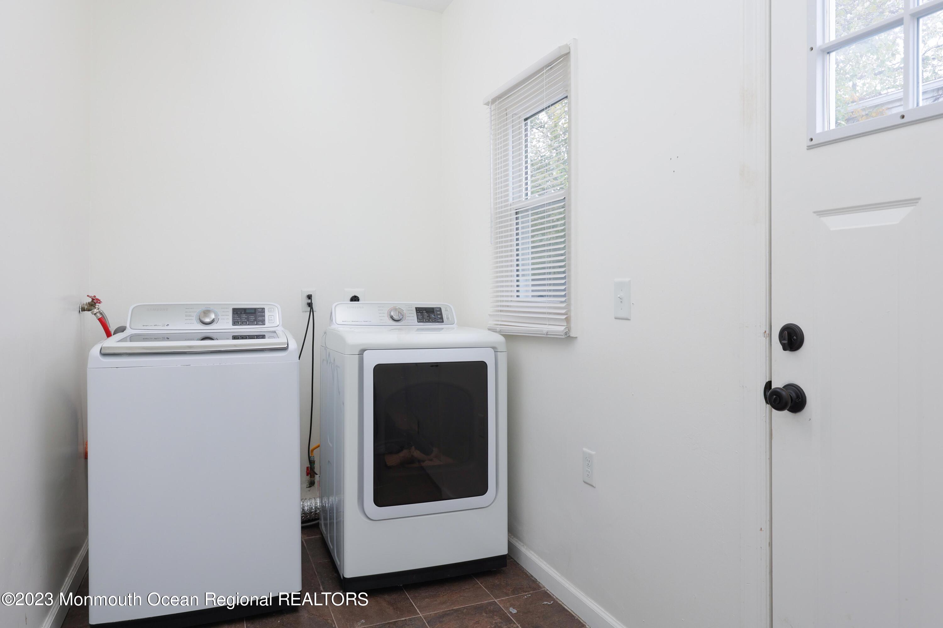 278 Broad Street, Unit FIRST Matawan, NJ 07747 - Photo 18 of 26 a utility room with dryer and washer