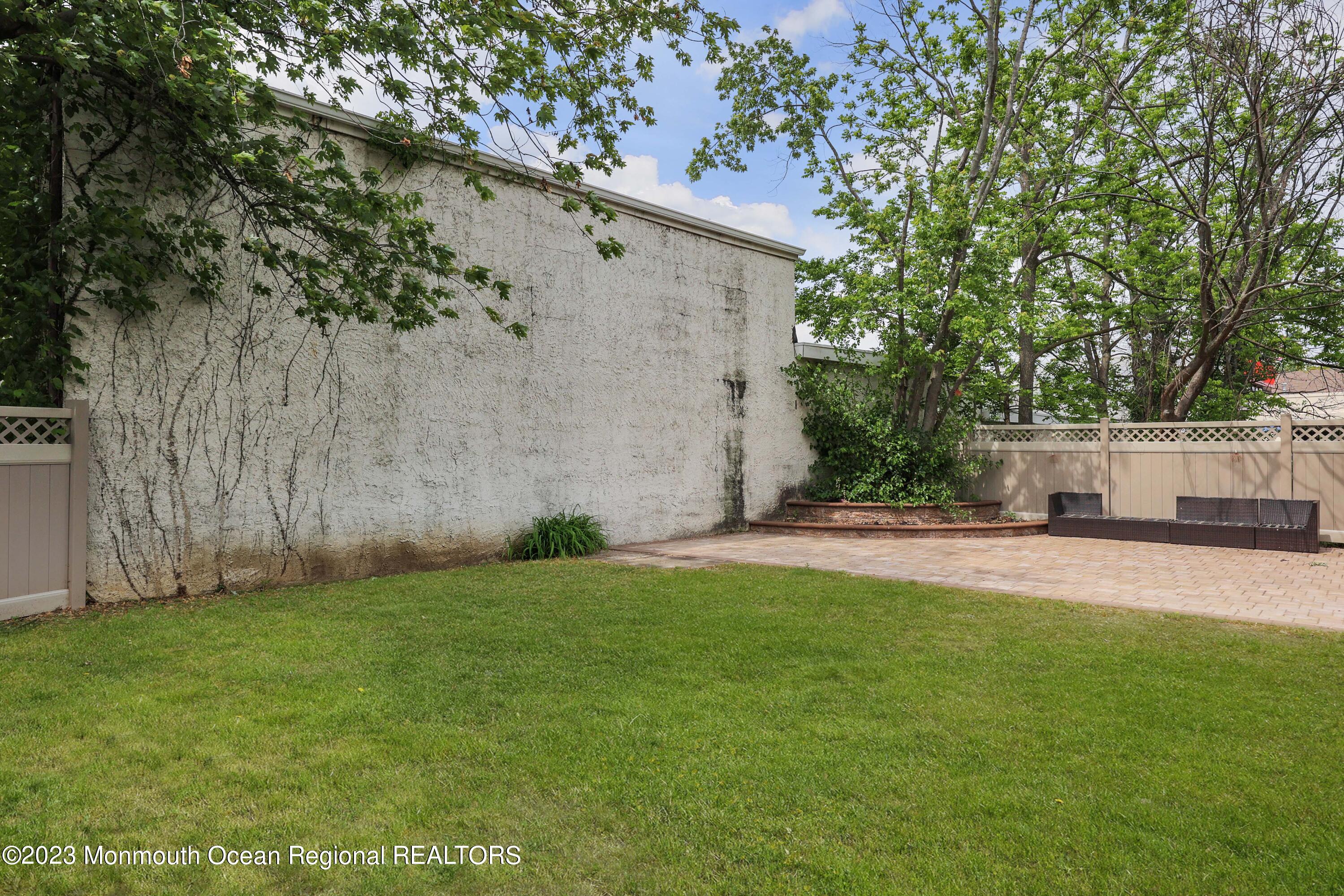 278 Broad Street, Unit FIRST Matawan, NJ 07747 - Photo 20 of 26 a view of a back yard