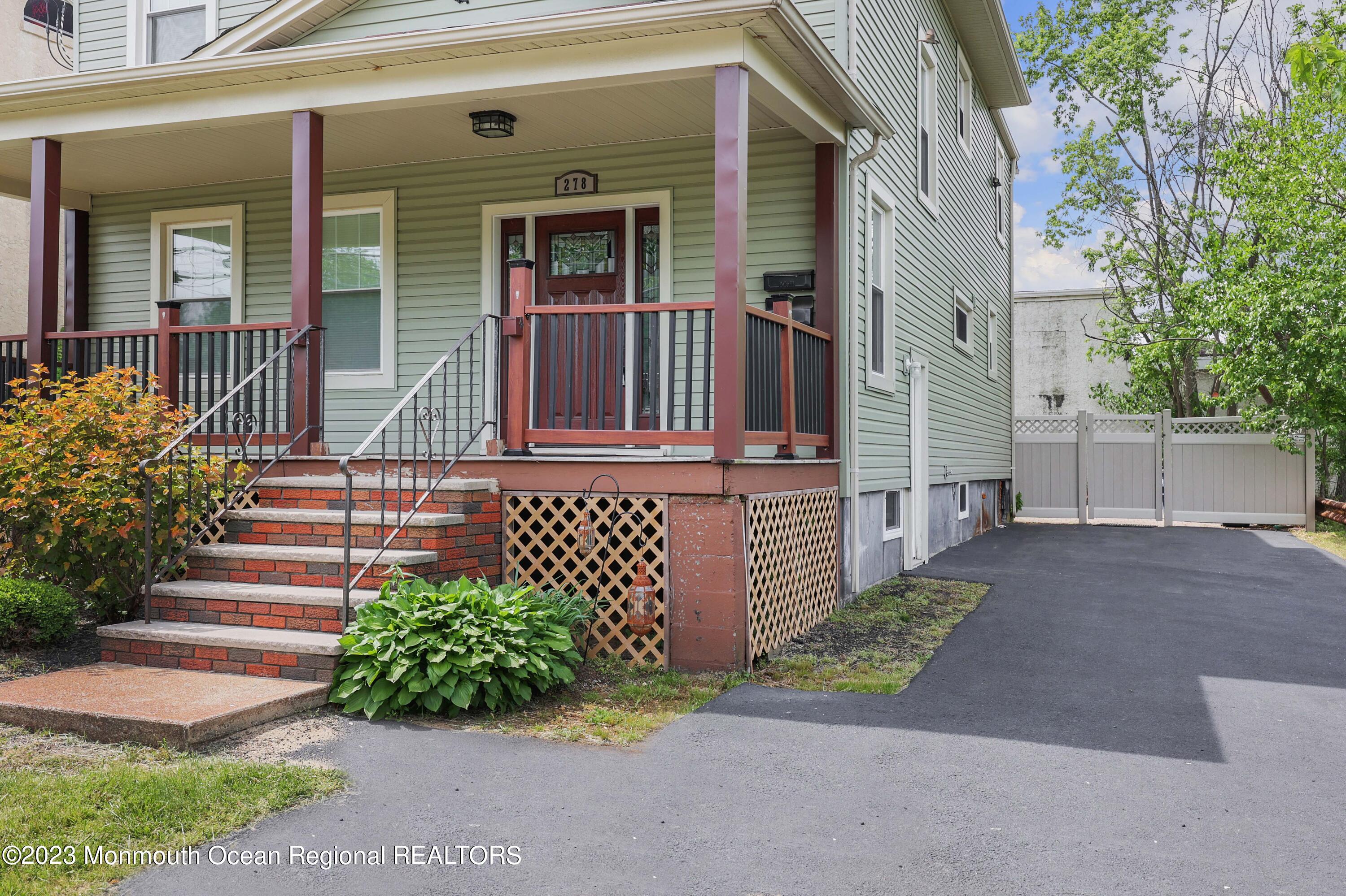 278 Broad Street, Unit FIRST Matawan, NJ 07747 - Photo 2 of 26 front view of a house with a street