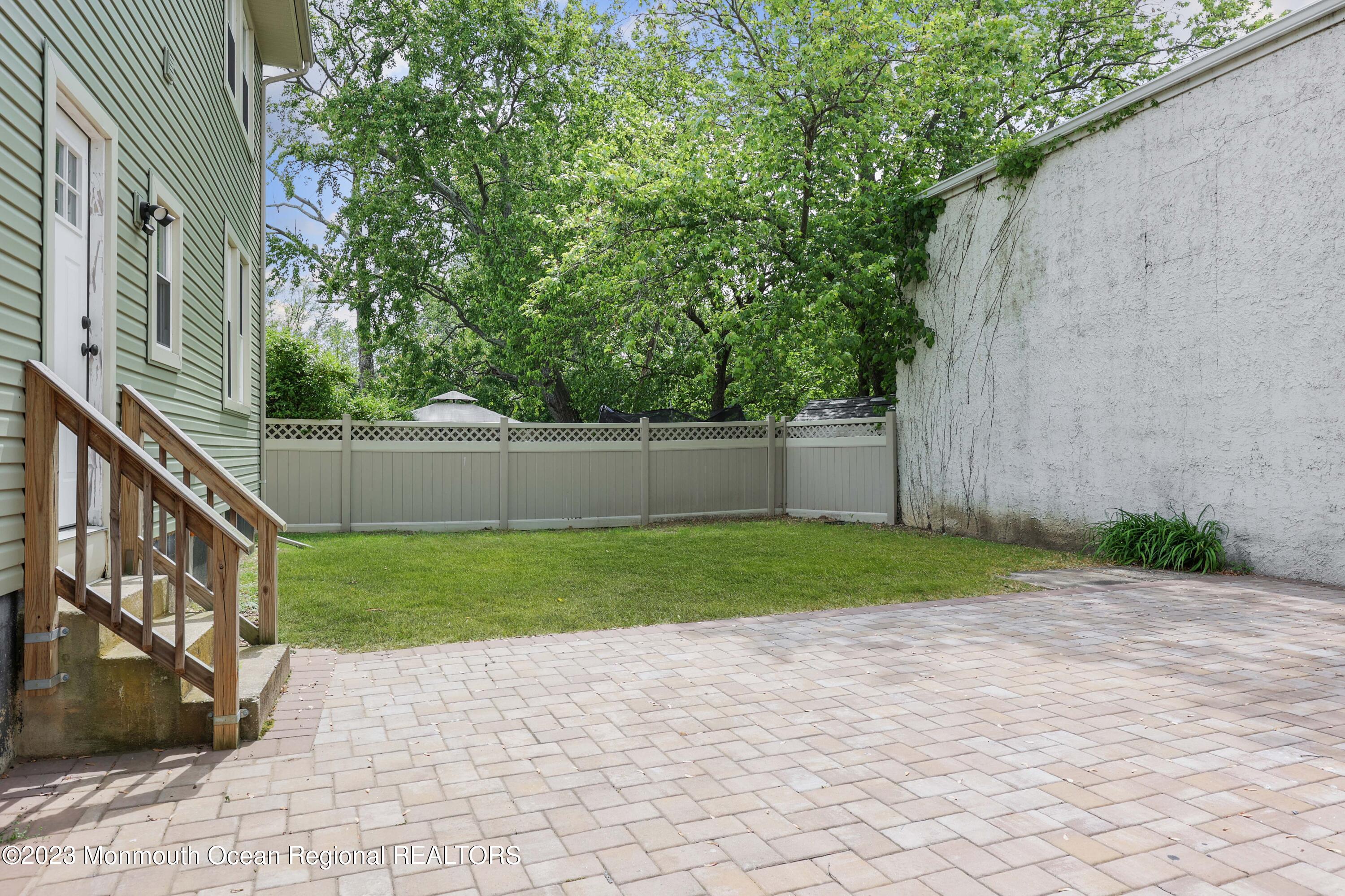 278 Broad Street, Unit FIRST Matawan, NJ 07747 - Photo 23 of 26 a view of backyard with green space