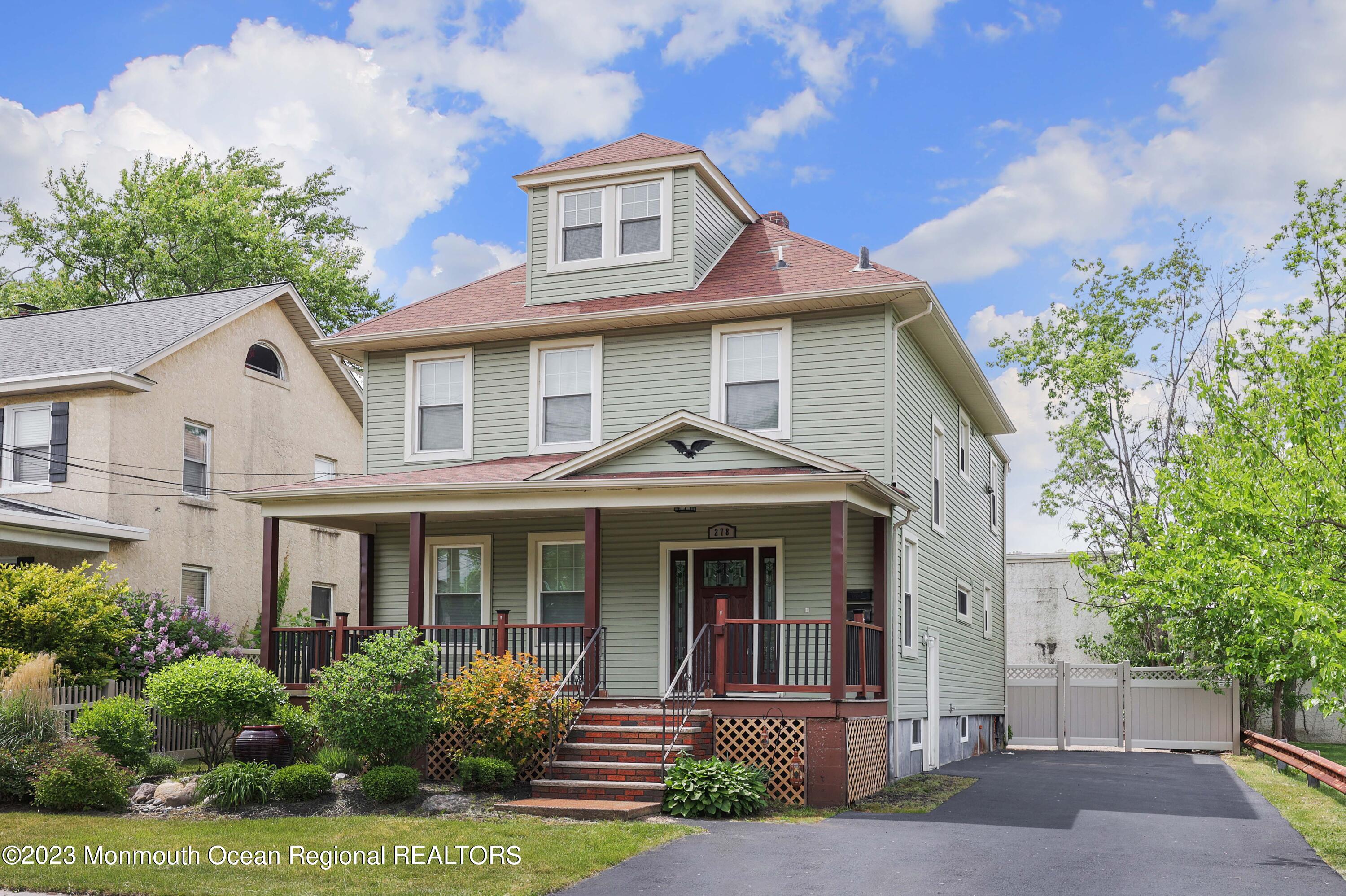 278 Broad Street, Unit FIRST Matawan, NJ 07747 - Photo 25 of 26 a front view of a house with garden