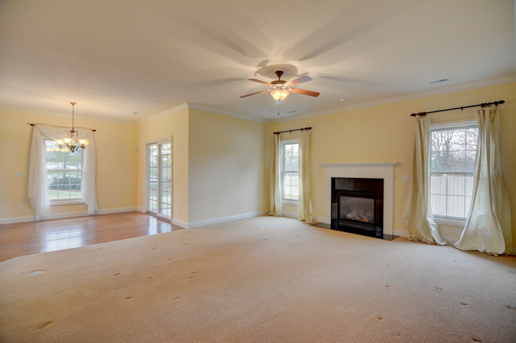 2930 Augusta Avenue Decatur, IL 62521 - Photo 7 of 28 a view of empty room with fireplace and fan