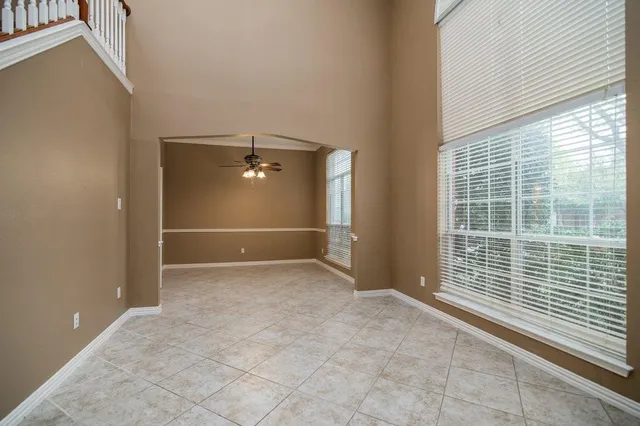 a view of an empty room with windows