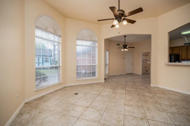 a view of an empty room with a bathroom