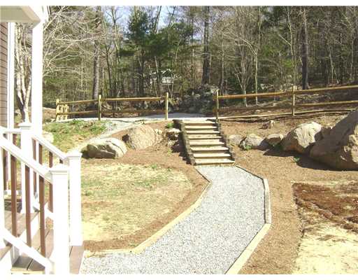 95 Tripps Corner Road Exeter, RI 02822 - Photo 16 of 20 Yard/Garden. New Front Walkway, Split Rail Fence and Landscaping Beds ready for your Planting