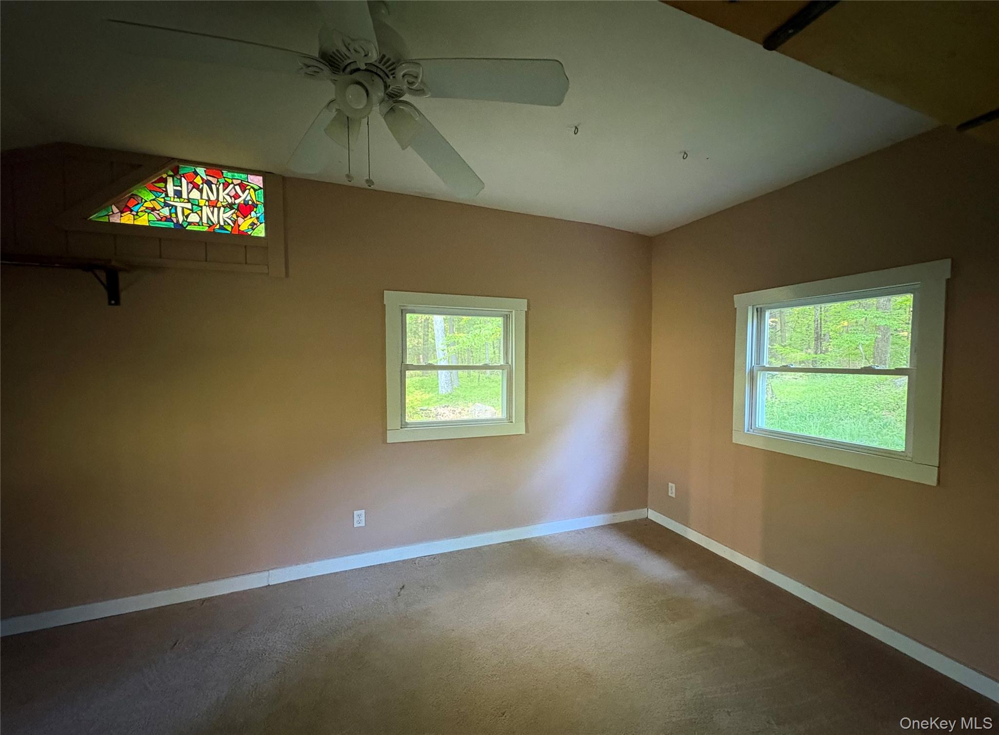 74 Lamoree Road Rhinebeck, NY 12572 - Photo 15 of 22 an empty room with windows and fan