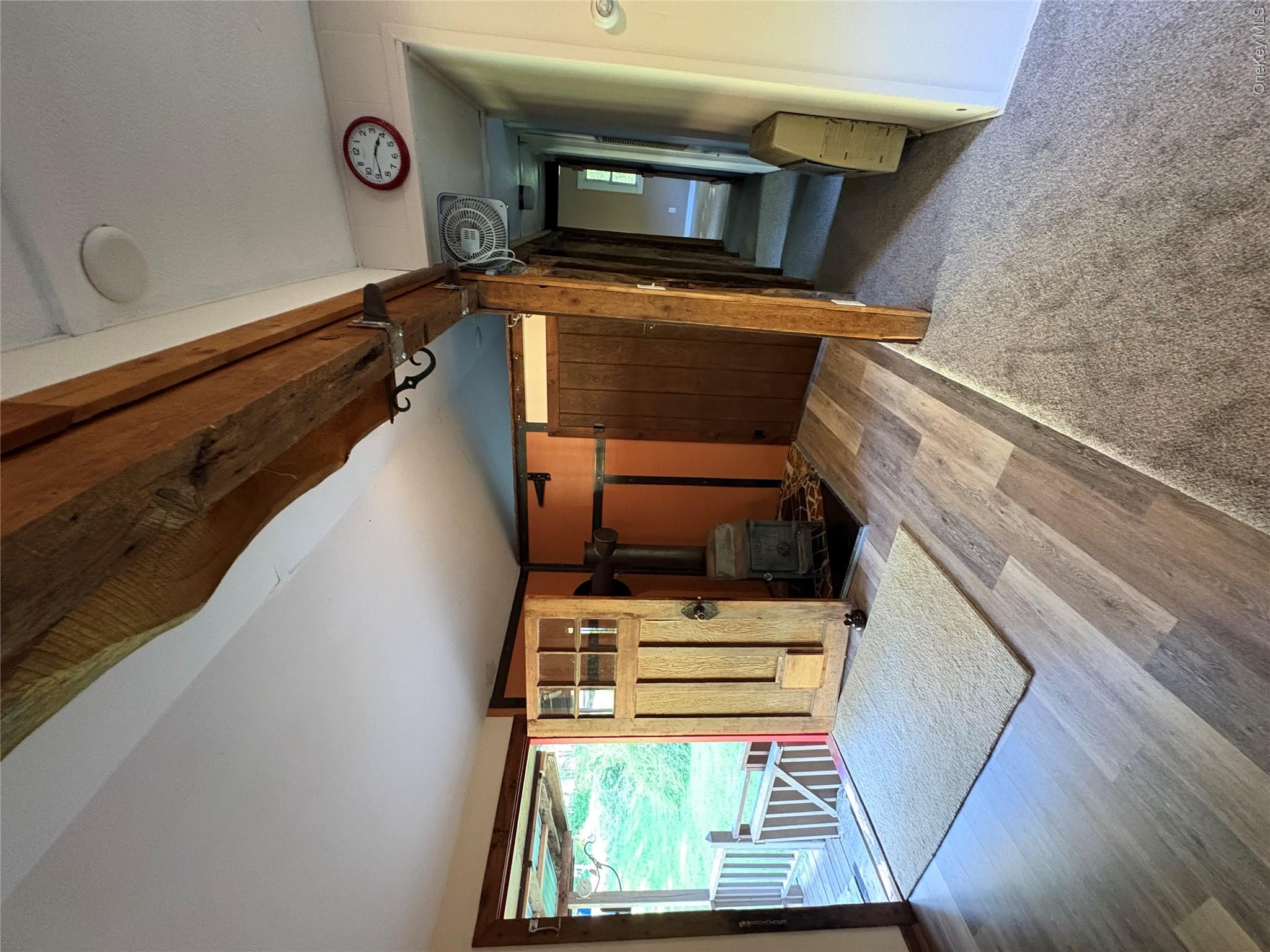 74 Lamoree Road Rhinebeck, NY 12572 - Photo 6 of 22 a view of a hallway with a large window