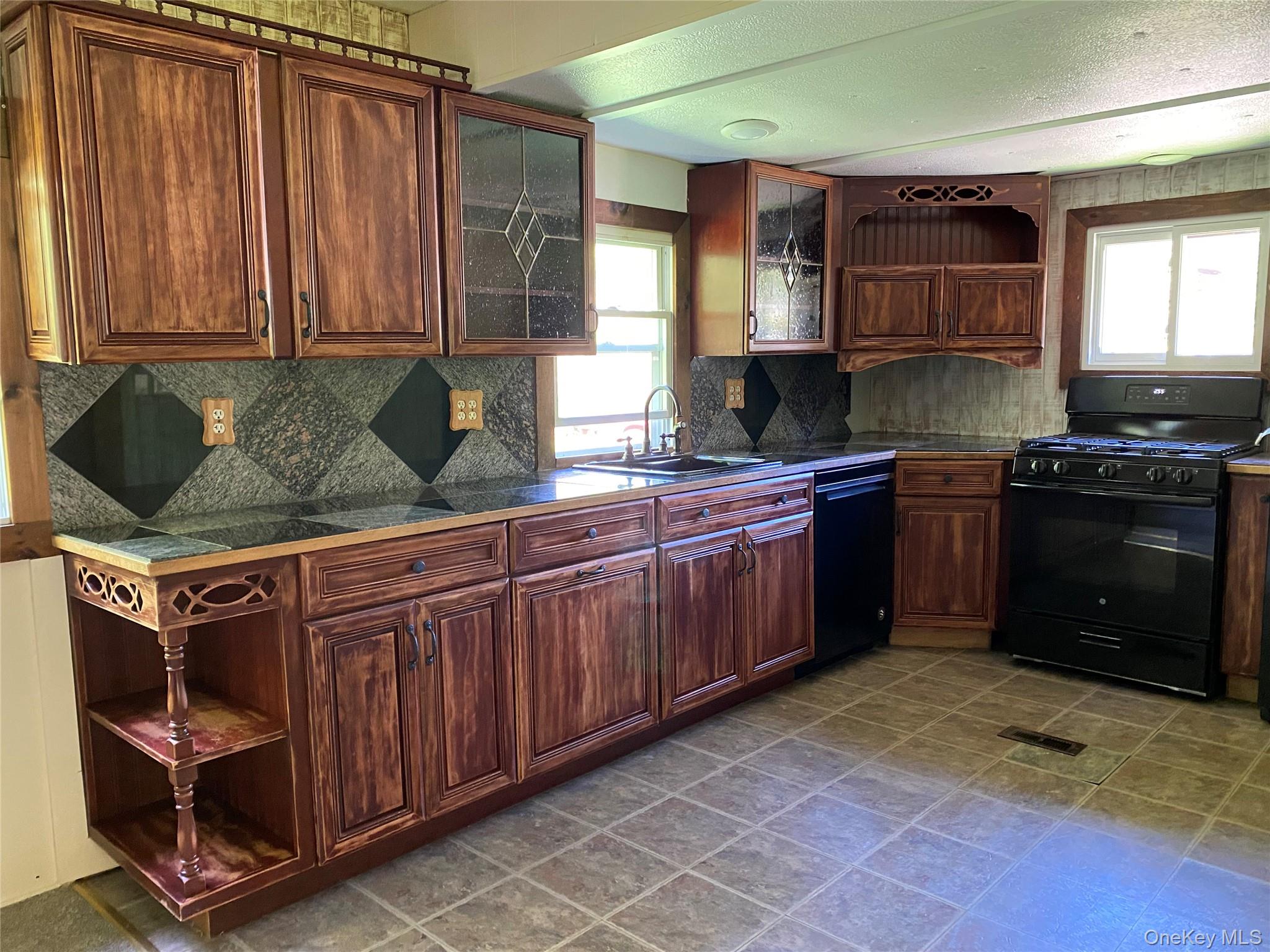 74 Lamoree Road Rhinebeck, NY 12572 - Photo 8 of 22 a kitchen with stainless steel appliances granite countertop a stove a sink and a microwave