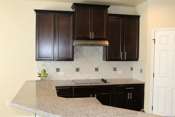a view of entryway with wooden cabinet