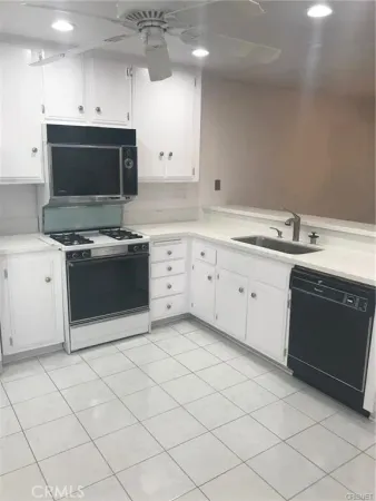a kitchen with a sink and a window