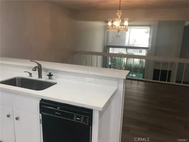 a large bathroom with a large mirror vanity and shower