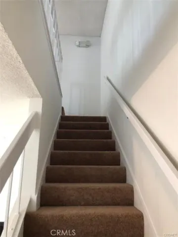 an empty room and chandelier fan