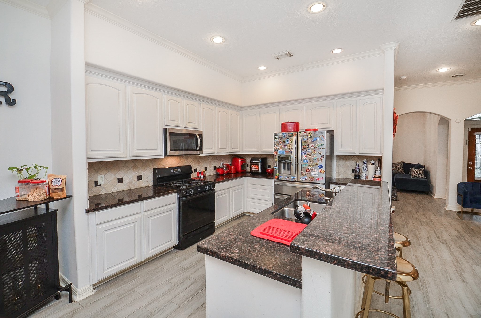 13511 Brookbluff Lane Houston, TX 77077 - Photo 11 of 16 a kitchen that has a lot of cabinets and refrigerator