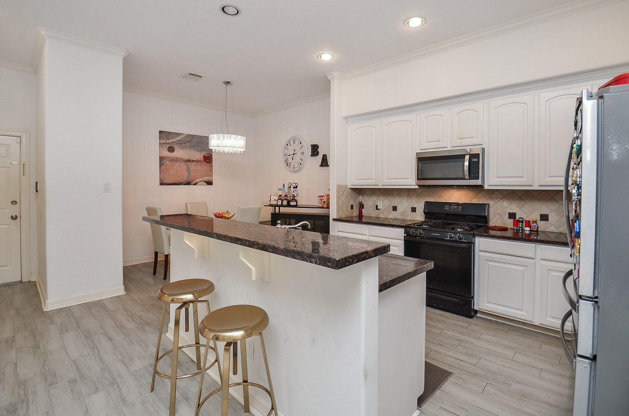 13511 Brookbluff Lane Houston, TX 77077 - Photo 12 of 16 a kitchen with stainless steel appliances granite countertop a sink stove and refrigerator