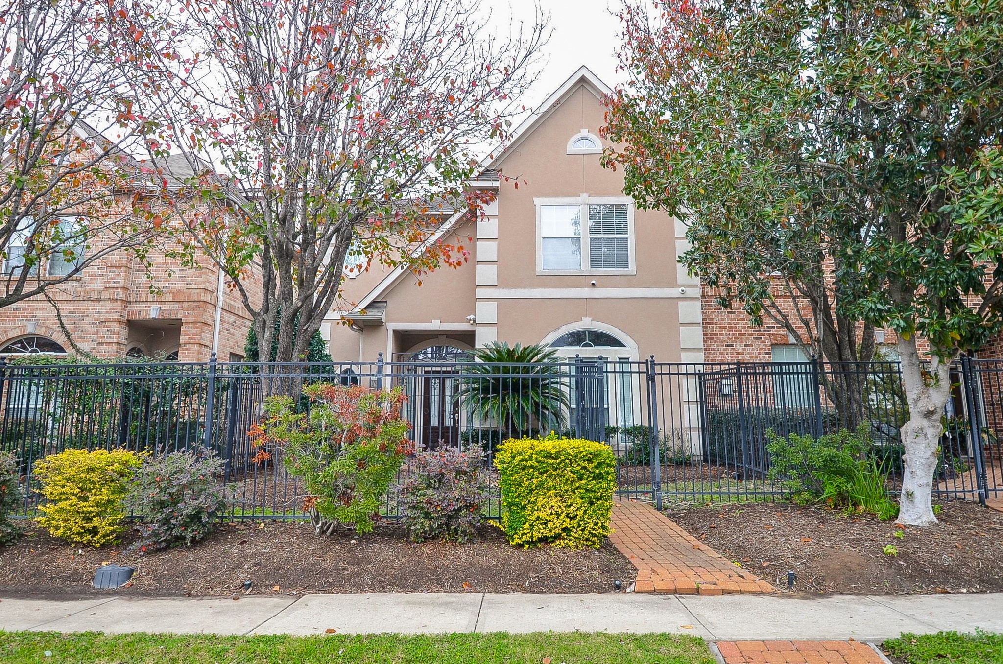 13511 Brookbluff Lane Houston, TX 77077 - Photo 2 of 16 a view of a house with a yard and garden