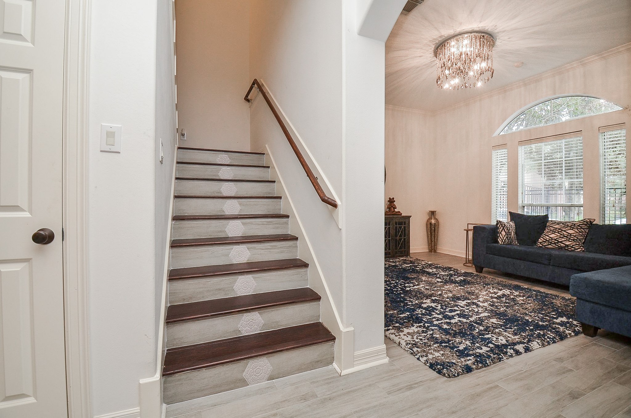 13511 Brookbluff Lane Houston, TX 77077 - Photo 7 of 16 a view of a livingroom with wooden floor and a chandelier