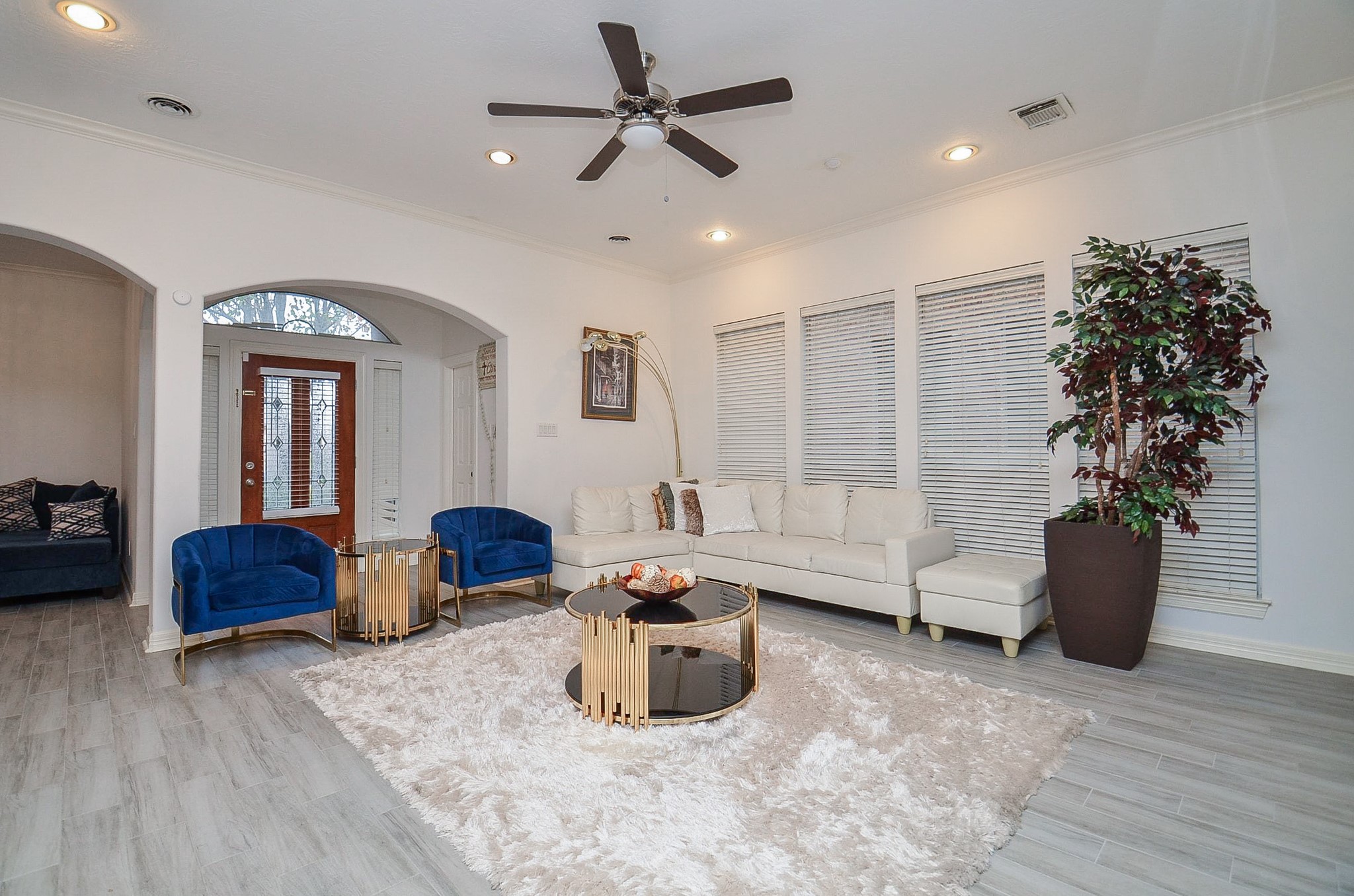 13511 Brookbluff Lane Houston, TX 77077 - Photo 8 of 16 a living room with furniture potted plant and a window