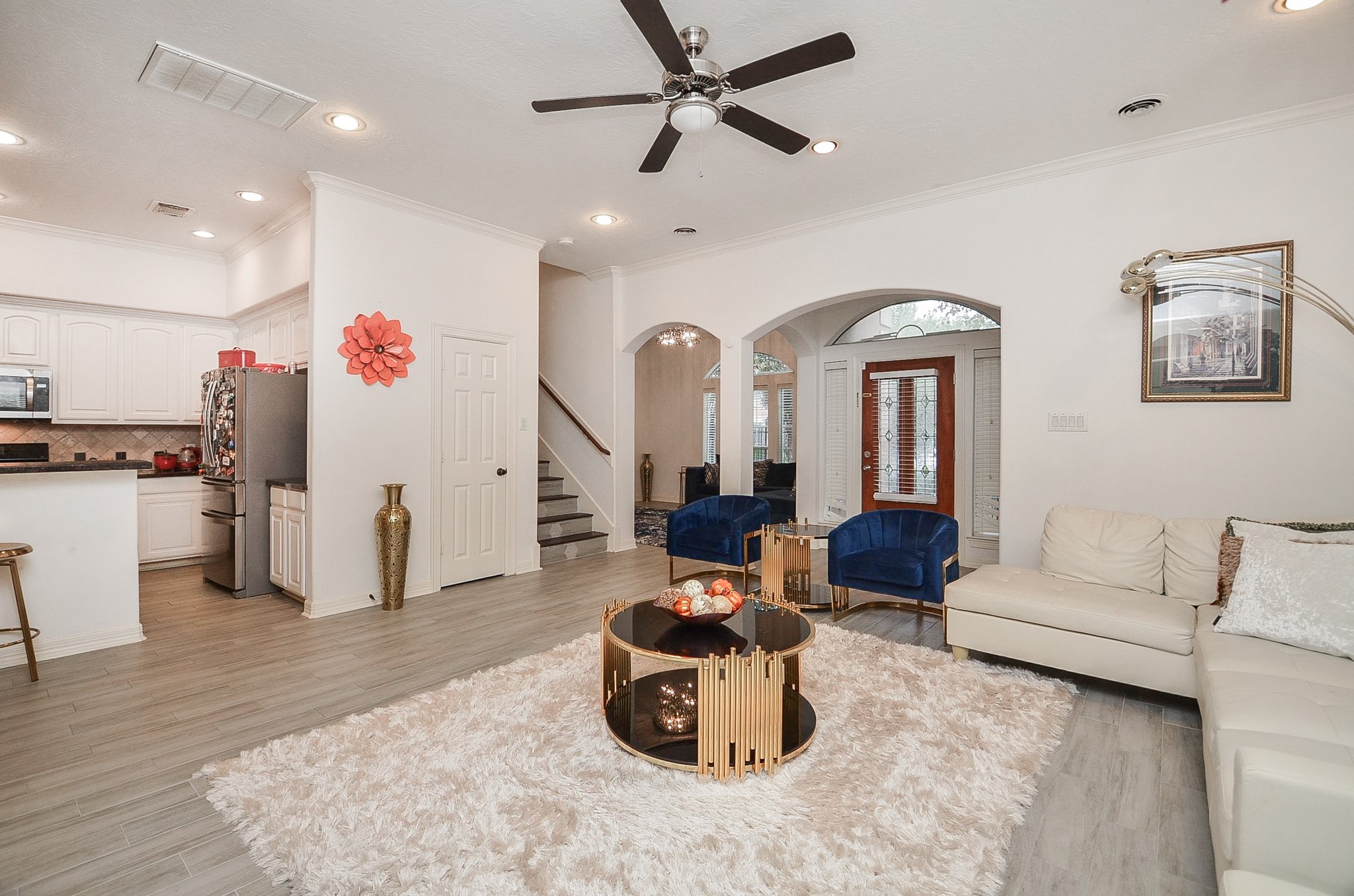 13511 Brookbluff Lane Houston, TX 77077 - Photo 9 of 16 a living room with furniture and kitchen view