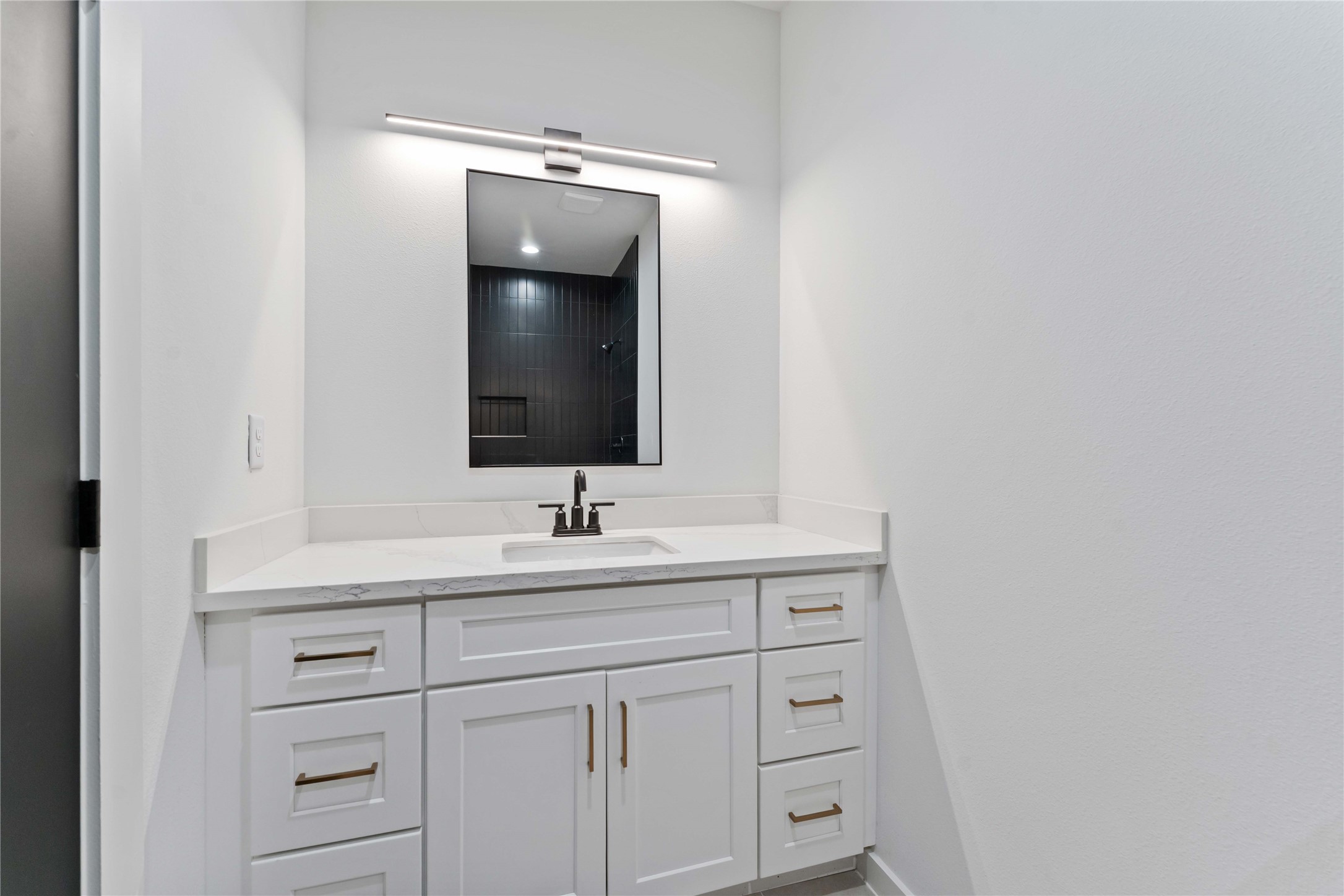 414 North Carolina Street, Unit A Houston, TX 77029 - Photo 23 of 25 a bathroom with a sink and a mirror