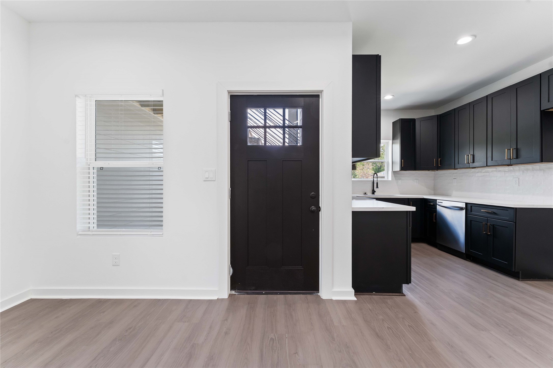 414 North Carolina Street, Unit A Houston, TX 77029 - Photo 4 of 25 a living room with stainless steel appliances kitchen island granite countertop a stove a sink and a refrigerator