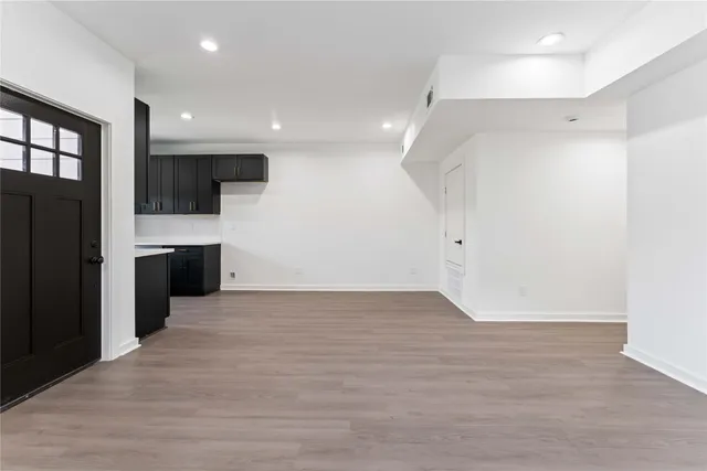a view of a kitchen with a refrigerator and a sink