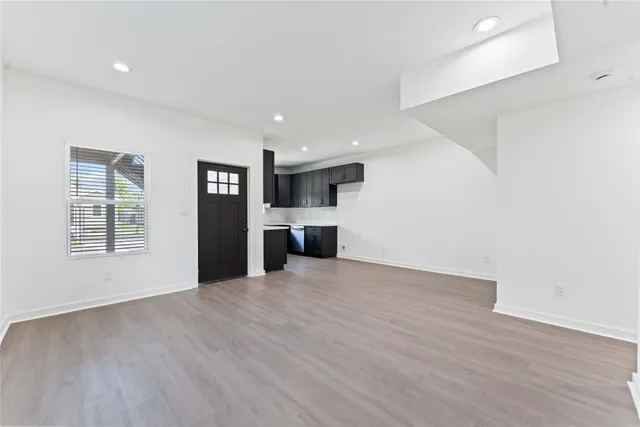 a view of a kitchen with a sink and a window