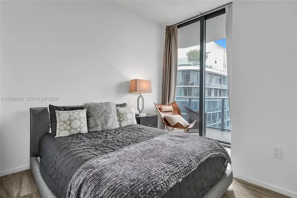 a view of a balcony with chair and table