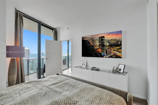 a bathroom with a double vanity sink toilet and mirror