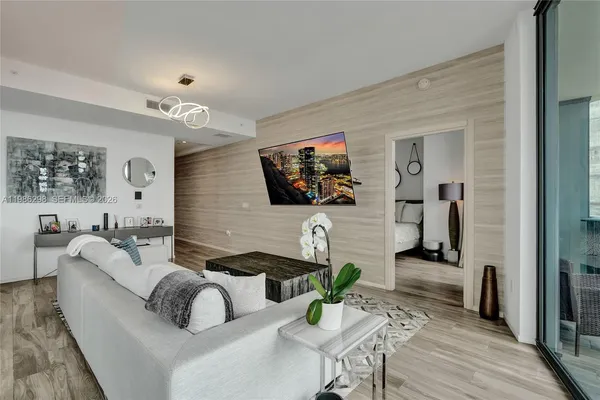 a living room with furniture and a flat screen tv