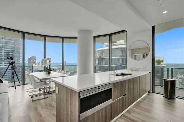 a kitchen with a sink cabinets and window