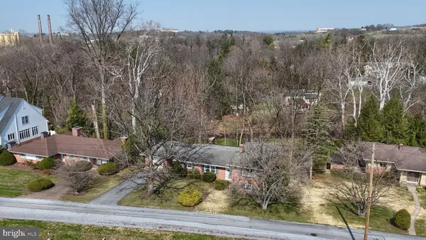 a aerial view of a house with a yard