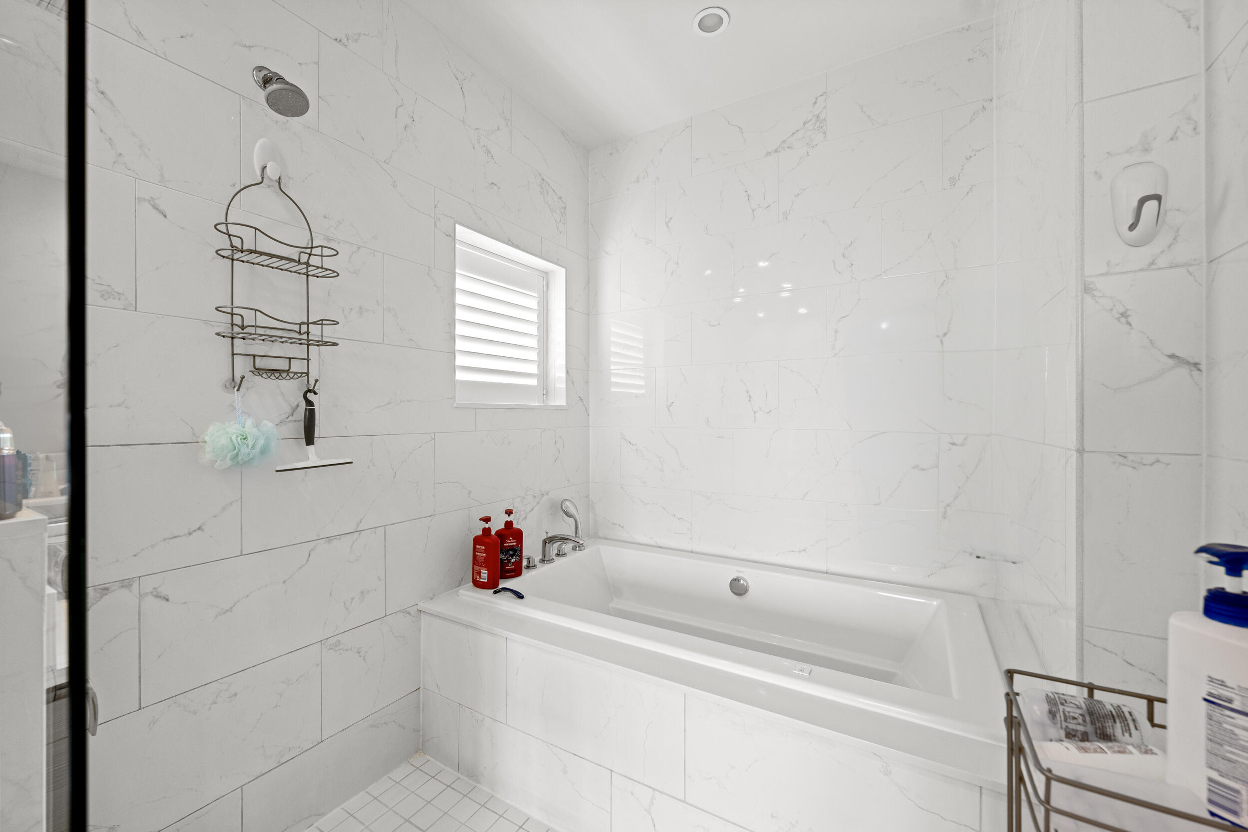 1811 Northwest 42nd Drive Boca Raton, FL 33431 - Photo 33 of 51 a bathroom with a bathtub and shower