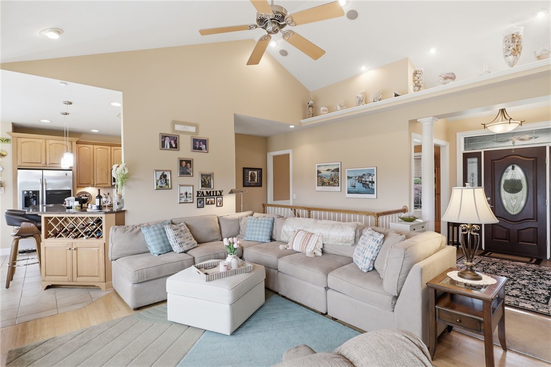 4536 Crystal Ridge Circle Gorham, NY 14424 - Photo 6 of 48 Beautiful cathedral ceilings create a spacious, open feel, perfectly complemented by the warmth of natural bamboo hardwood floors throughout the home.