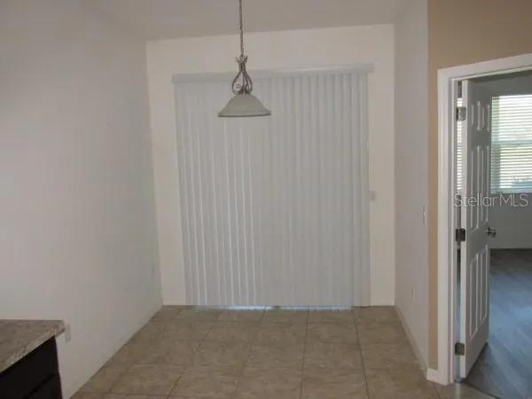 an empty room with a hallway