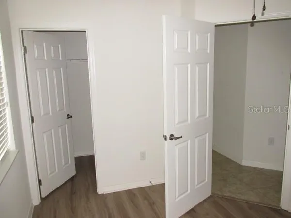 an empty room with wooden floor