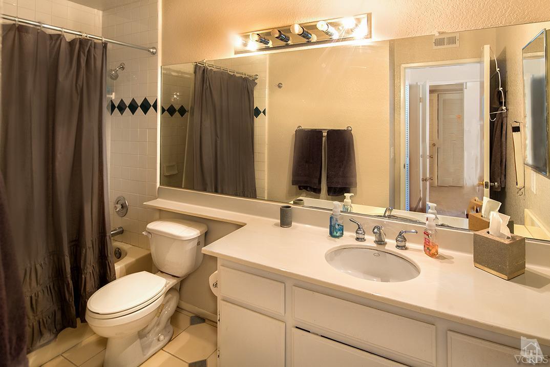 1175 Fitzgerald Road, Unit A Simi Valley, CA 93065 - Photo 11 of 16 a bathroom with a sink toilet and shower