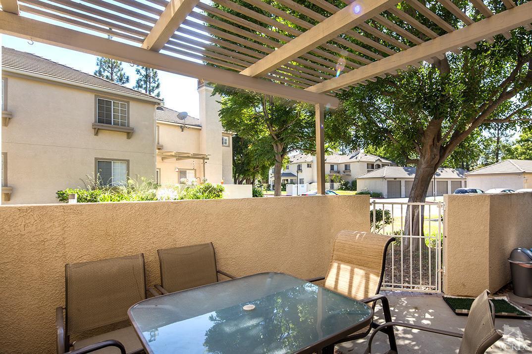 1175 Fitzgerald Road, Unit A Simi Valley, CA 93065 - Photo 13 of 16 a view of balcony with a table and chairs